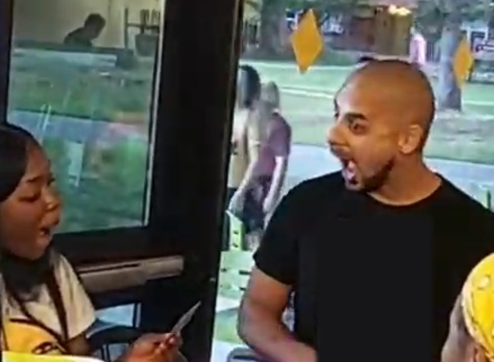 A guest reacts to Eric Mina's close-up magic