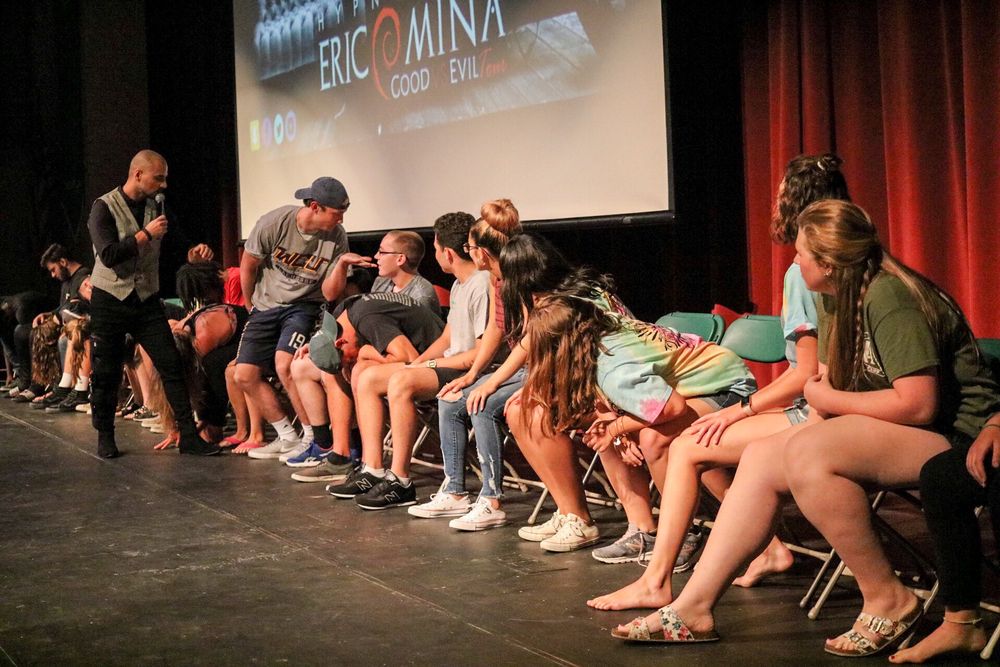 Volunteers on stage during Eric Mina's hypnosis show